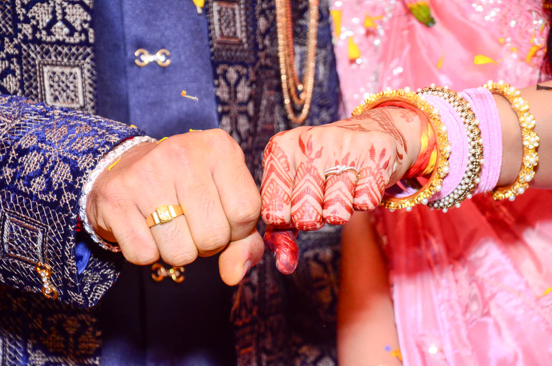 Close-up of bridal bangles and henna