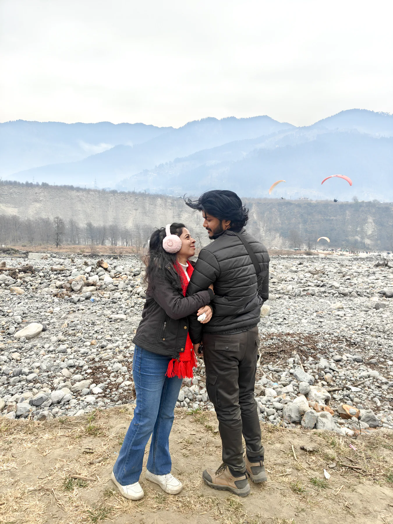 Pooja and Yuvaraj posing by the mountain riverbed
