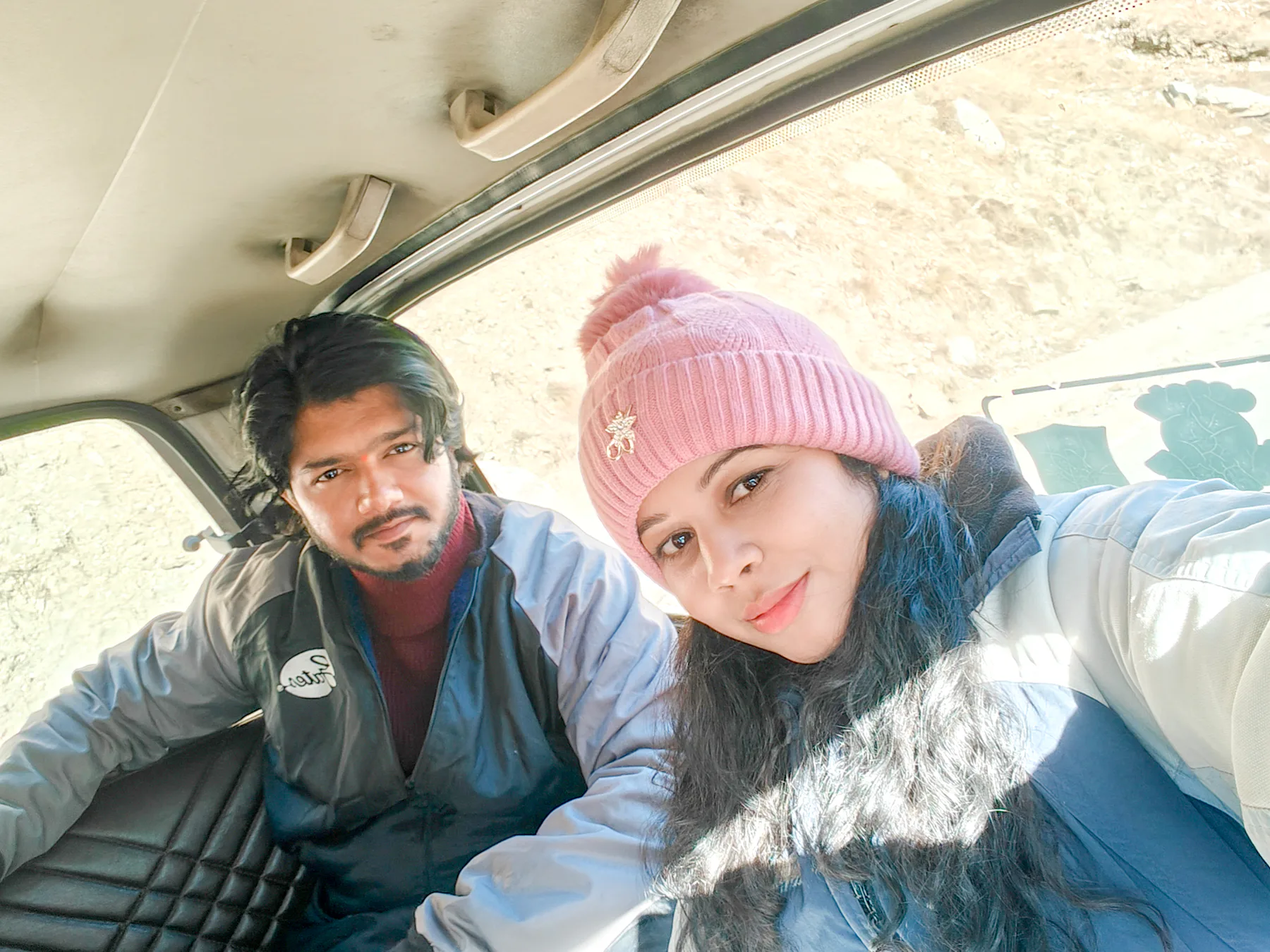 Pooja smiling during a travel moment